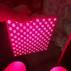 LED light panel emitting a pinkish-red glow